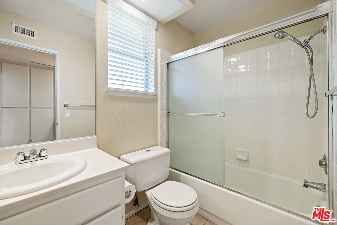 27050 Riversbridge Way Valencia, CA 91354 - Photo 18 of 37 a bathroom with a sink toilet and shower