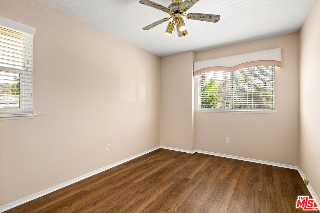 27050 Riversbridge Way Valencia, CA 91354 - Photo 19 of 37 wooden floor in an empty room with a window