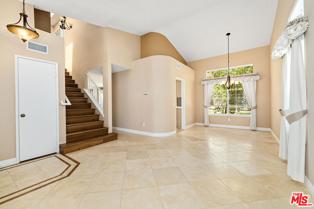 27050 Riversbridge Way Valencia, CA 91354 - Photo 2 of 37 a view of an entryway with staircase