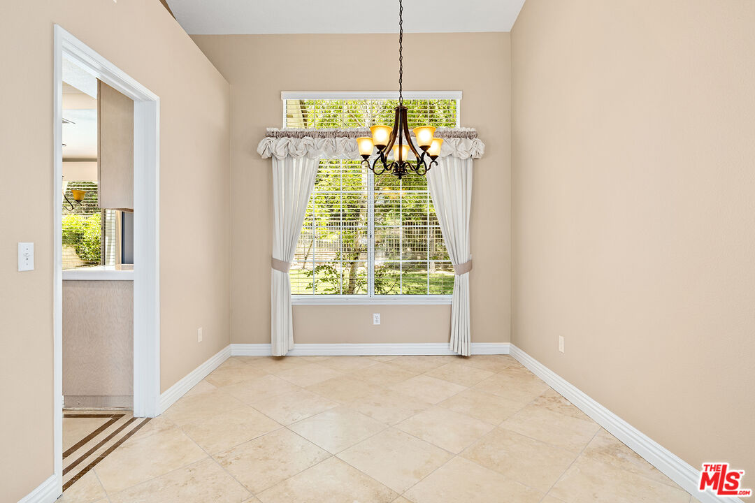 27050 Riversbridge Way Valencia, CA 91354 - Photo 3 of 37 a view of room with window and chandelier