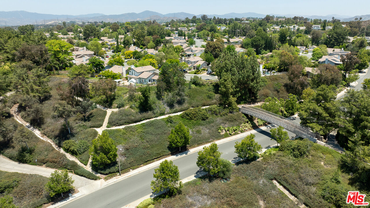 27050 Riversbridge Way Valencia, CA 91354 - Photo 33 of 37 an aerial view of residential houses with outdoor space and trees