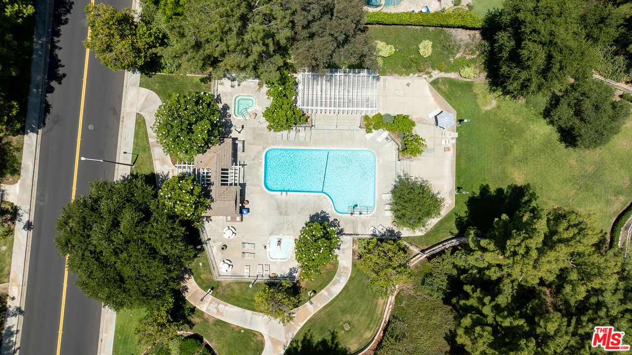 27050 Riversbridge Way Valencia, CA 91354 - Photo 34 of 37 an aerial view of a house with a yard and swimming pool