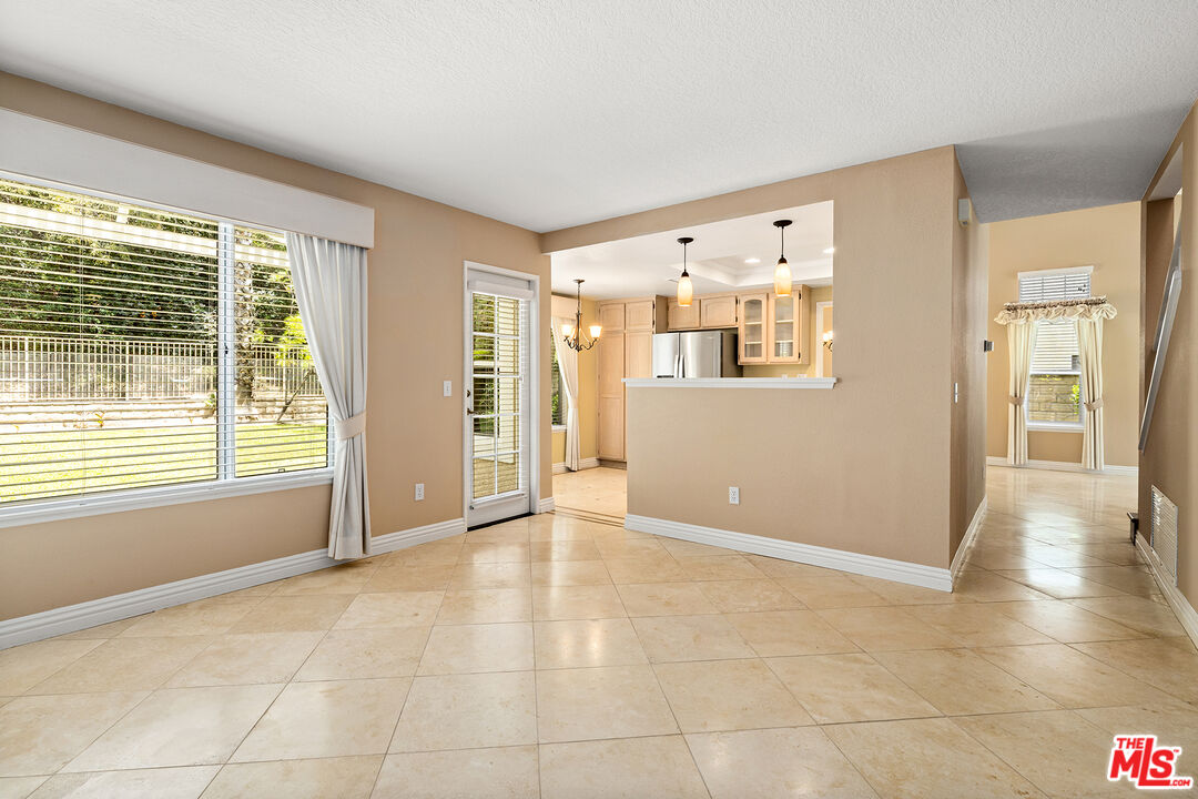 27050 Riversbridge Way Valencia, CA 91354 - Photo 7 of 37 a view of an empty room with a window