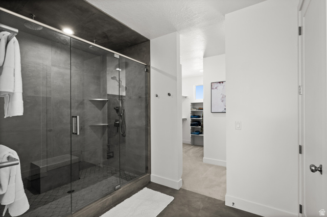 507 West Windmill Gate Cove Draper, UT 84020 - Photo 27 of 46 Bathroom featuring baseboards and a shower stall