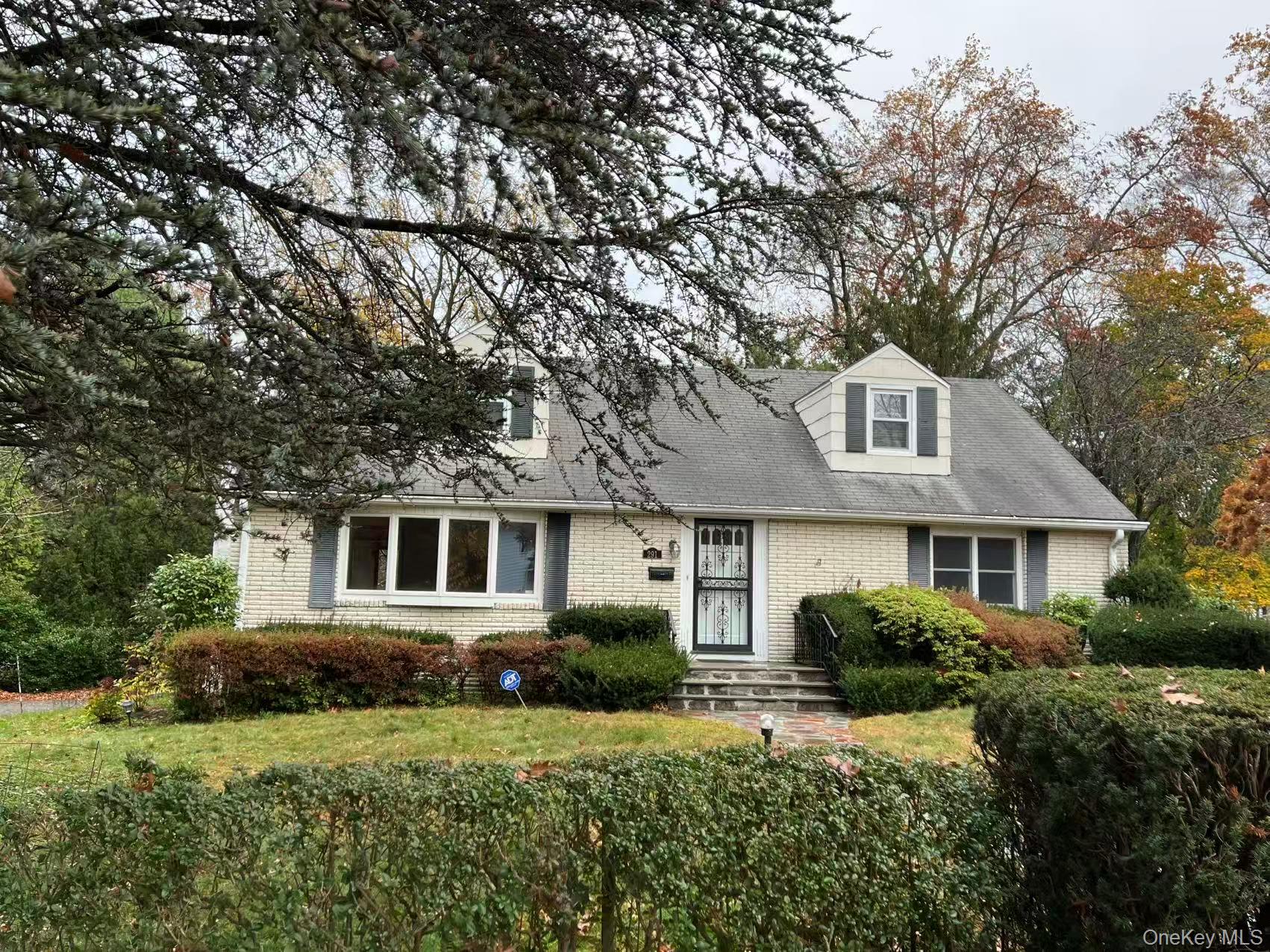 291 Boulevard Scarsdale, NY 10583 - Photo 1 of 31 a front view of a house with a yard