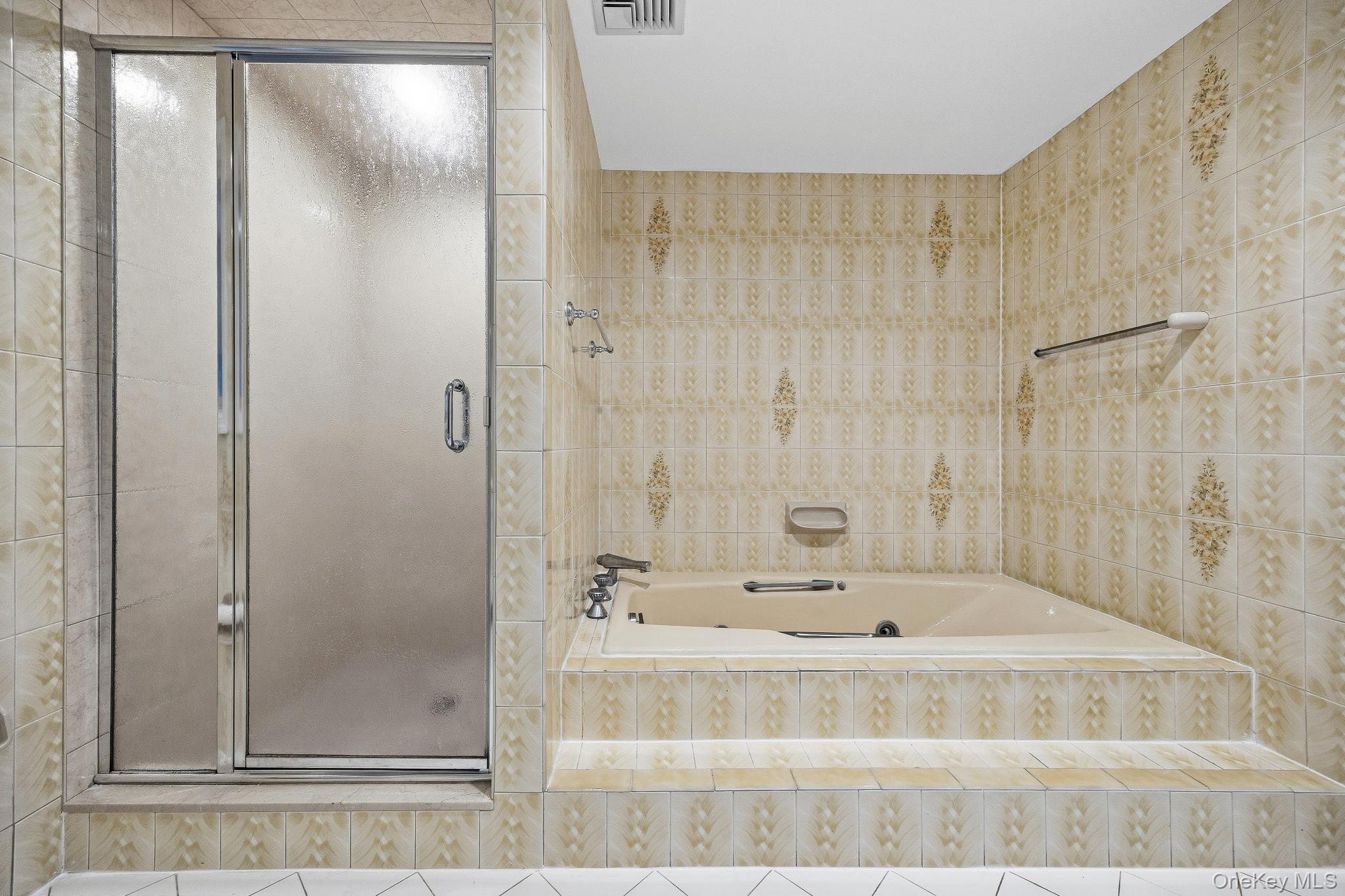 291 Boulevard Scarsdale, NY 10583 - Photo 15 of 31 a bathroom with a tub and shower