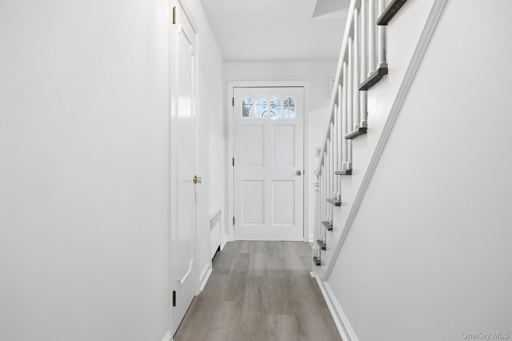 291 Boulevard Scarsdale, NY 10583 - Photo 17 of 31 a view of a hallway with wooden floor and entryway