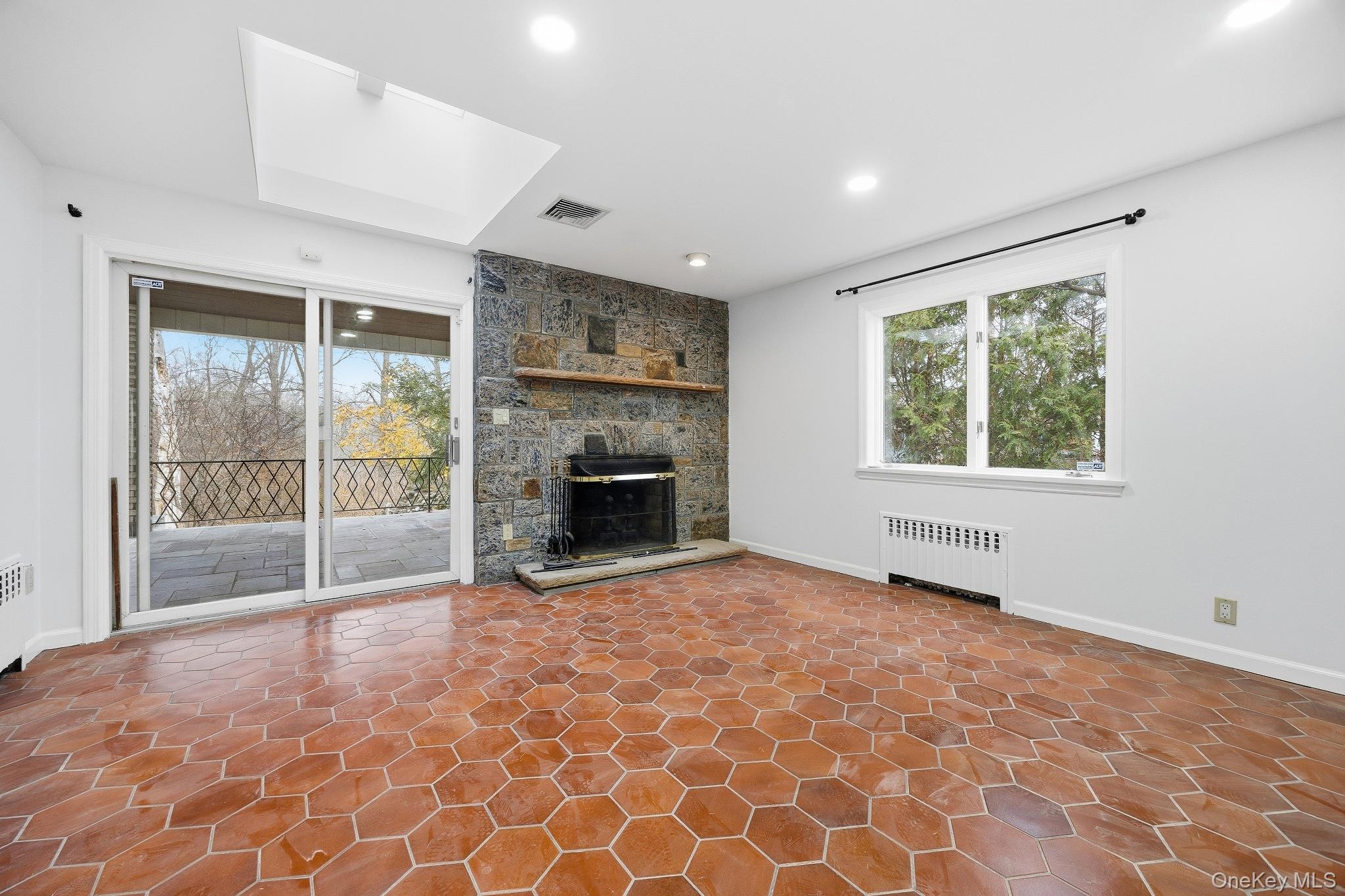 291 Boulevard Scarsdale, NY 10583 - Photo 18 of 31 an empty room with windows and fireplace