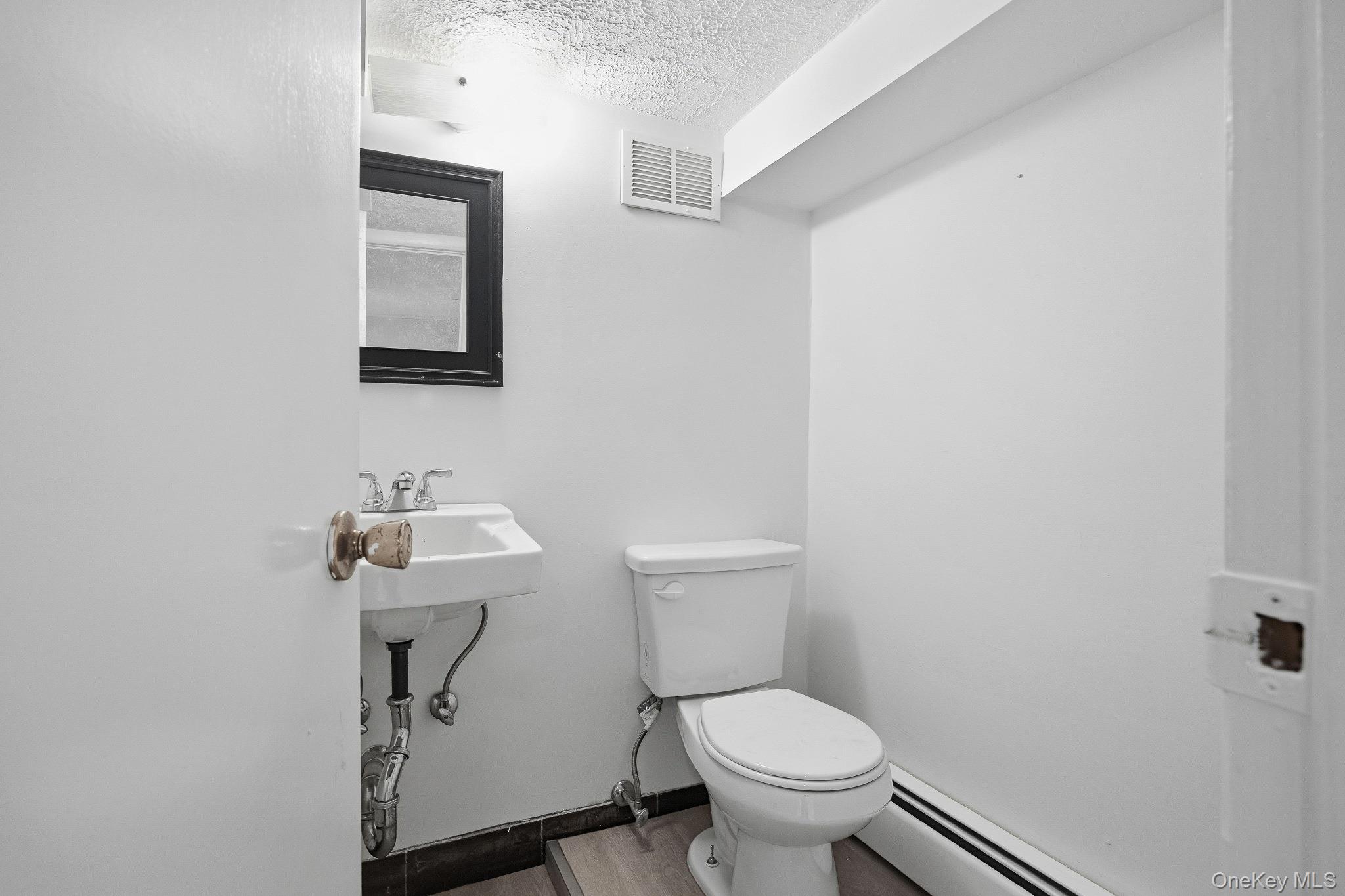 291 Boulevard Scarsdale, NY 10583 - Photo 24 of 31 a bathroom with a toilet a sink and mirror