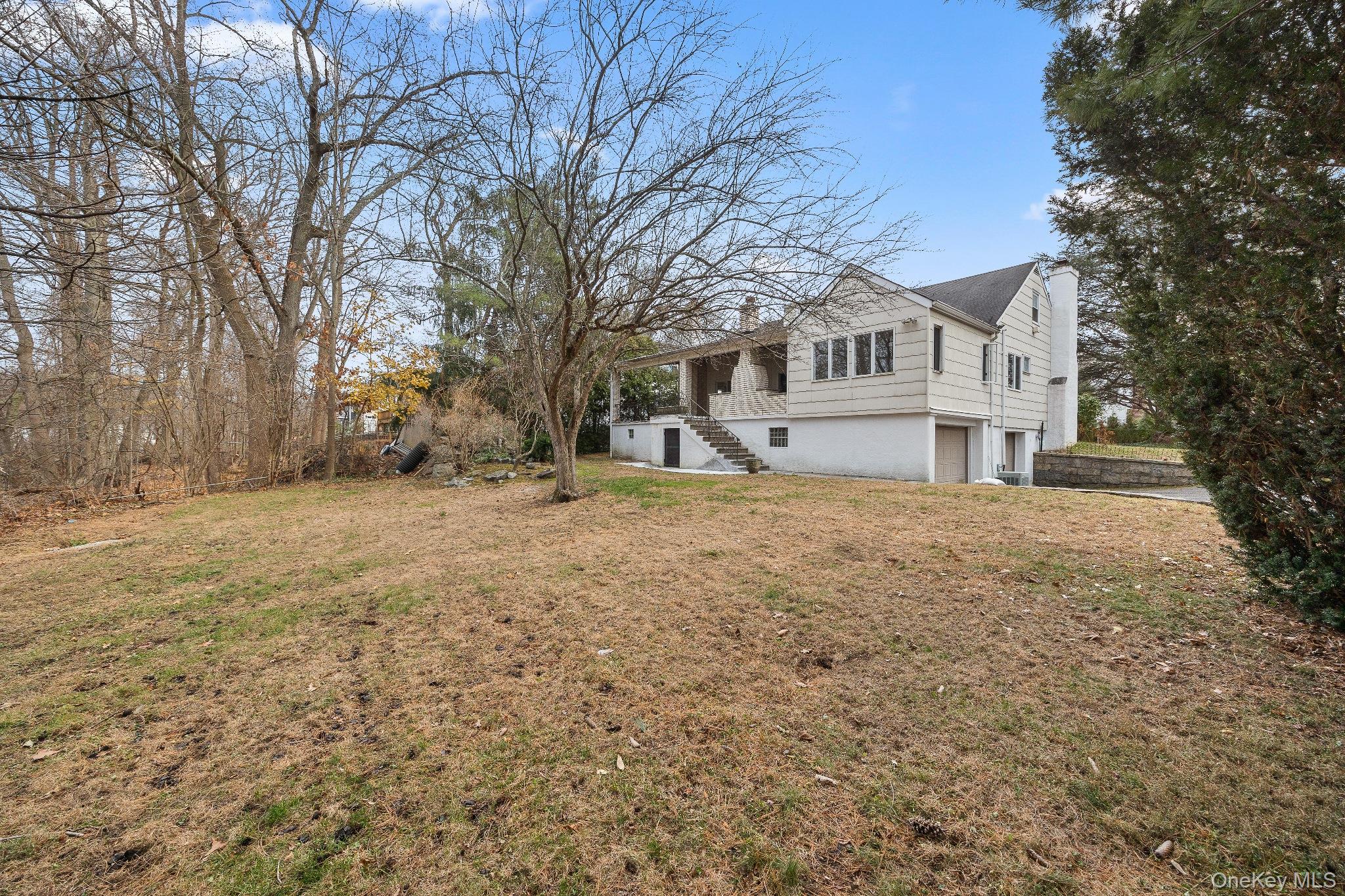 291 Boulevard Scarsdale, NY 10583 - Photo 30 of 31 a house that has a tree in front of it