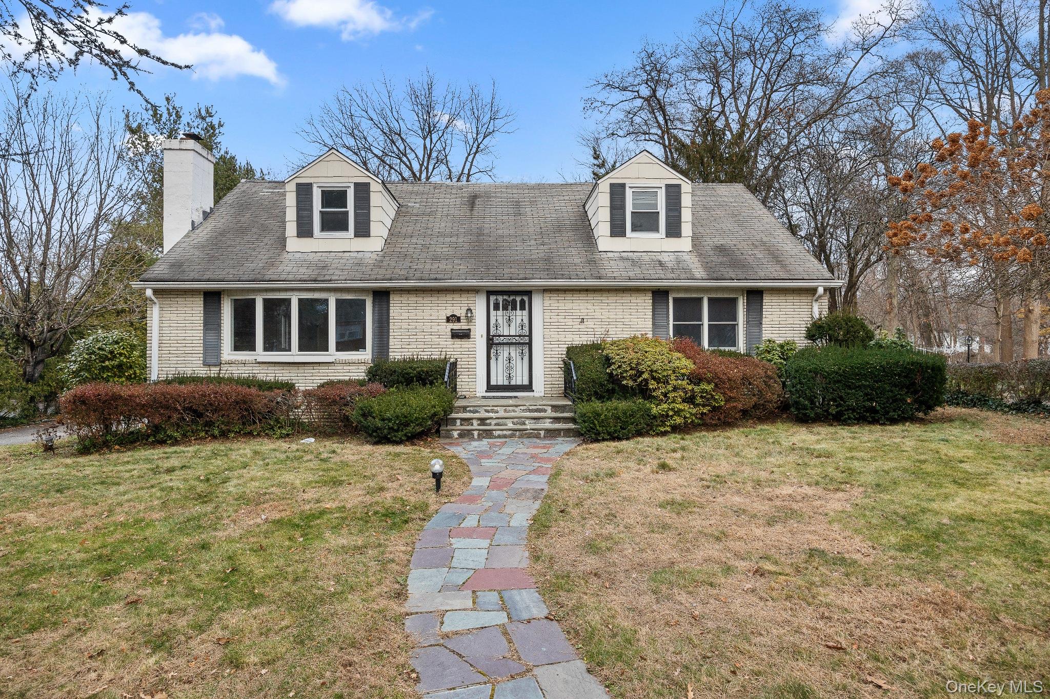 291 Boulevard Scarsdale, NY 10583 - Photo 4 of 31 a front view of a house with a yard