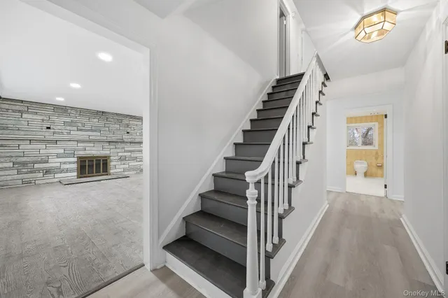 a view of a hallway with staircase