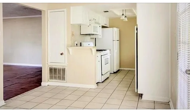 a utility room with cabinets