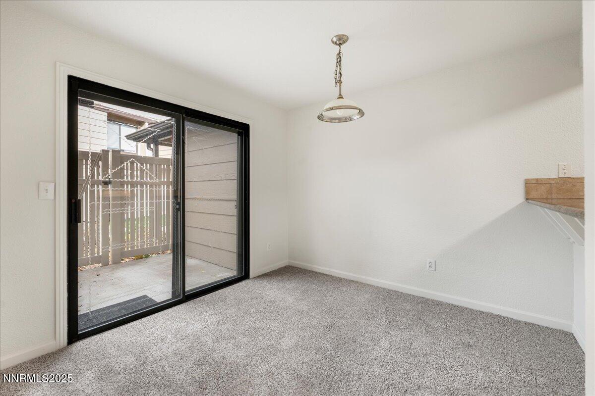 4418 Matich Drive Reno, NV 89502 - Photo 12 of 37 a view of empty room with floor to ceiling window