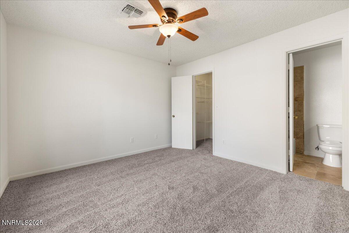 4418 Matich Drive Reno, NV 89502 - Photo 20 of 37 an empty room with a ceiling fan and a window