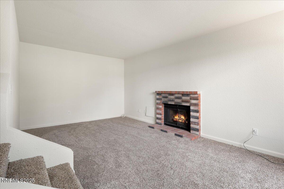 4418 Matich Drive Reno, NV 89502 - Photo 2 of 37 a view of an empty room with a fireplace