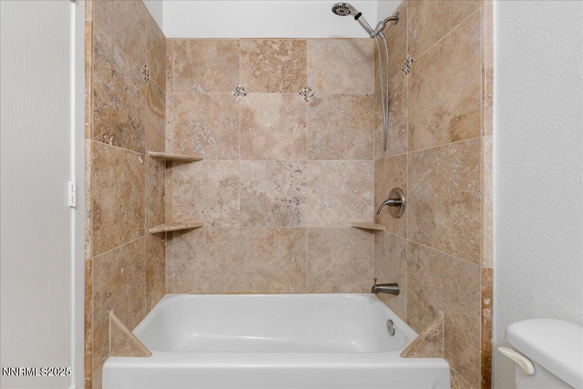 4418 Matich Drive Reno, NV 89502 - Photo 23 of 37 a bathroom with a bathtub