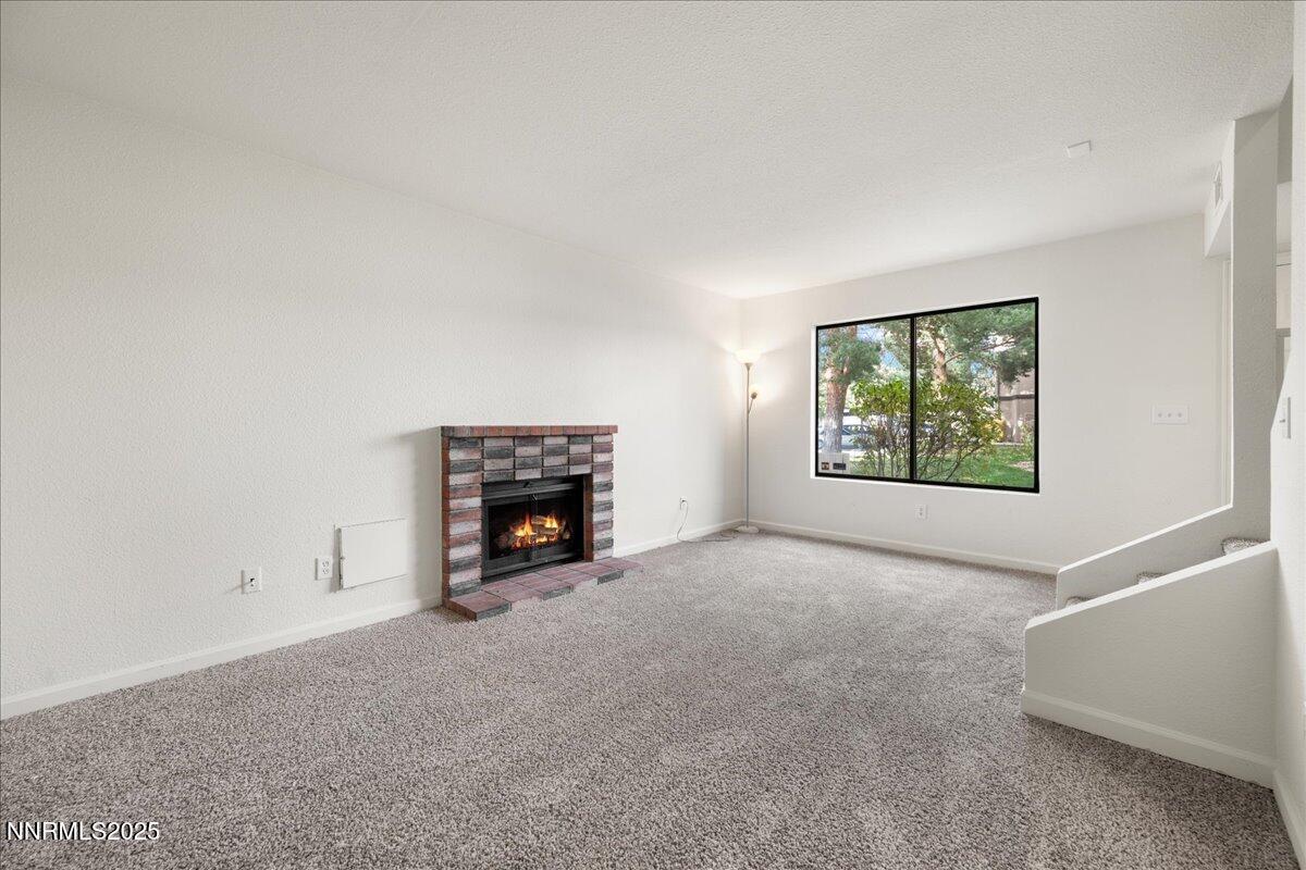 4418 Matich Drive Reno, NV 89502 - Photo 3 of 37 an empty room with windows and fireplace