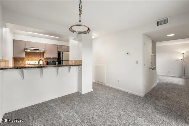 a view of a kitchen with a sink