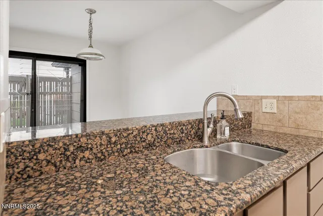 a kitchen with a sink and a window