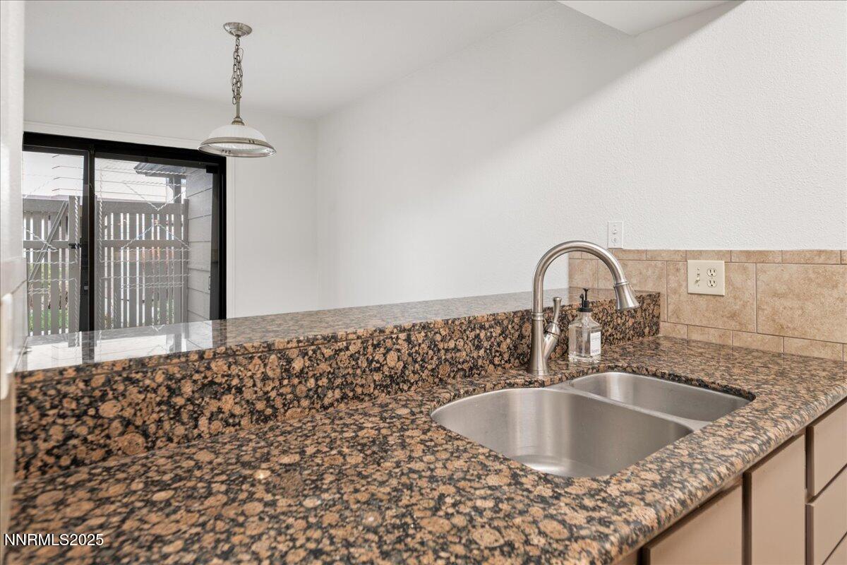 4418 Matich Drive Reno, NV 89502 - Photo 8 of 37 a kitchen with a sink and a window