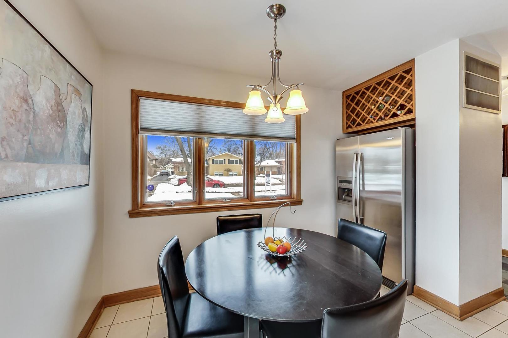 715 Lamon Avenue Wilmette, IL 60091 - Photo 15 of 54 a view of a dining room with furniture window and outside view