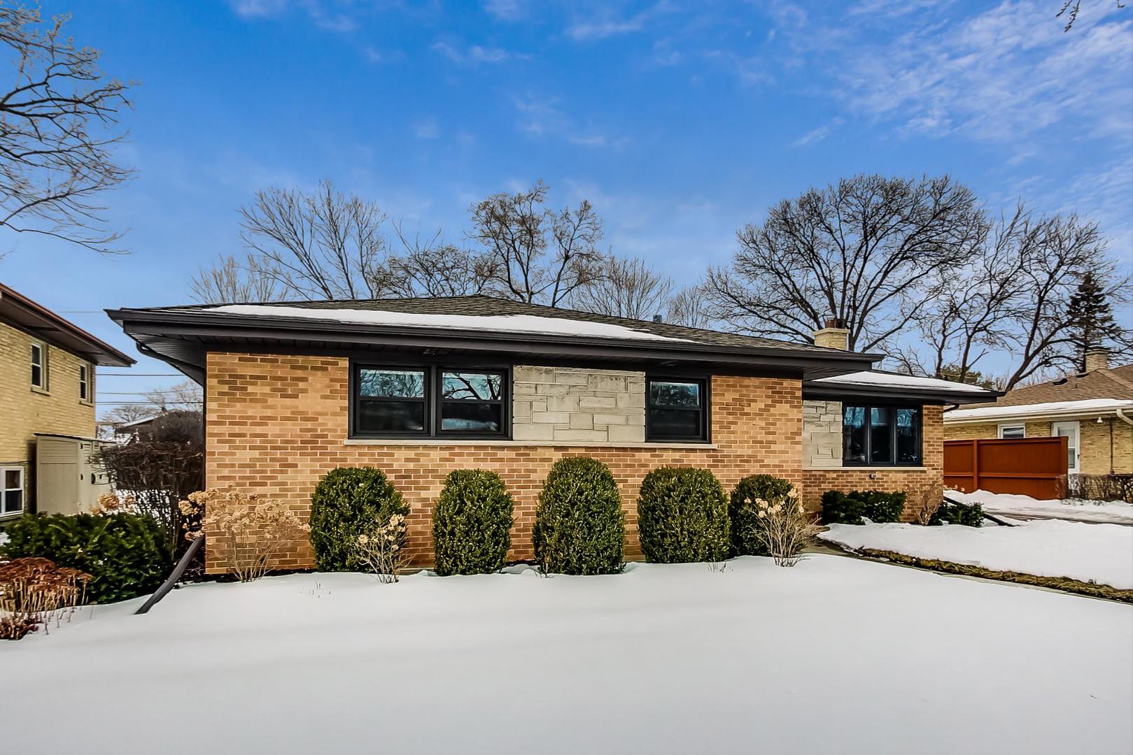 715 Lamon Avenue Wilmette, IL 60091 - Photo 2 of 54 a front view of a house with garden
