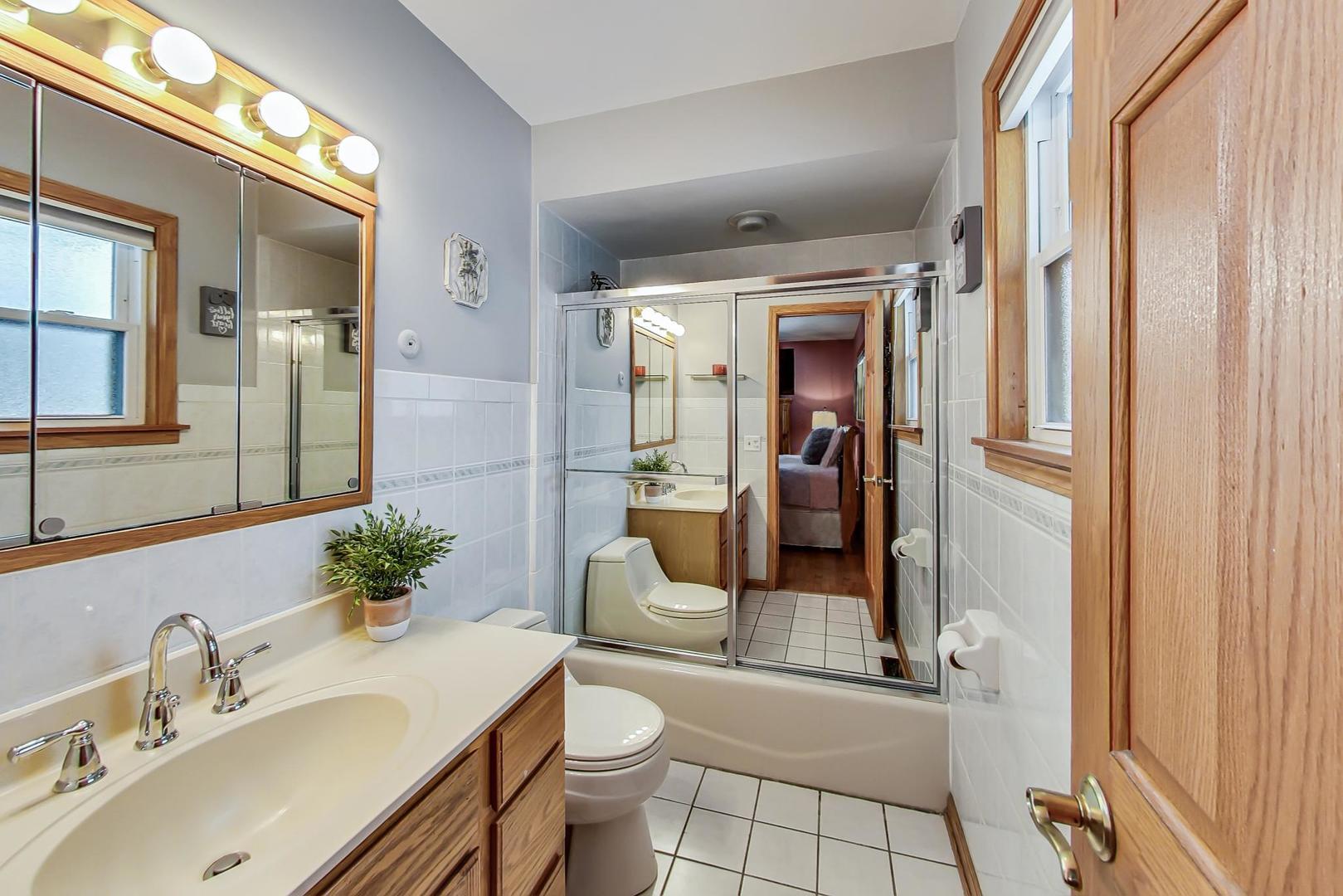 715 Lamon Avenue Wilmette, IL 60091 - Photo 24 of 54 a bathroom with a sink a toilet and shower