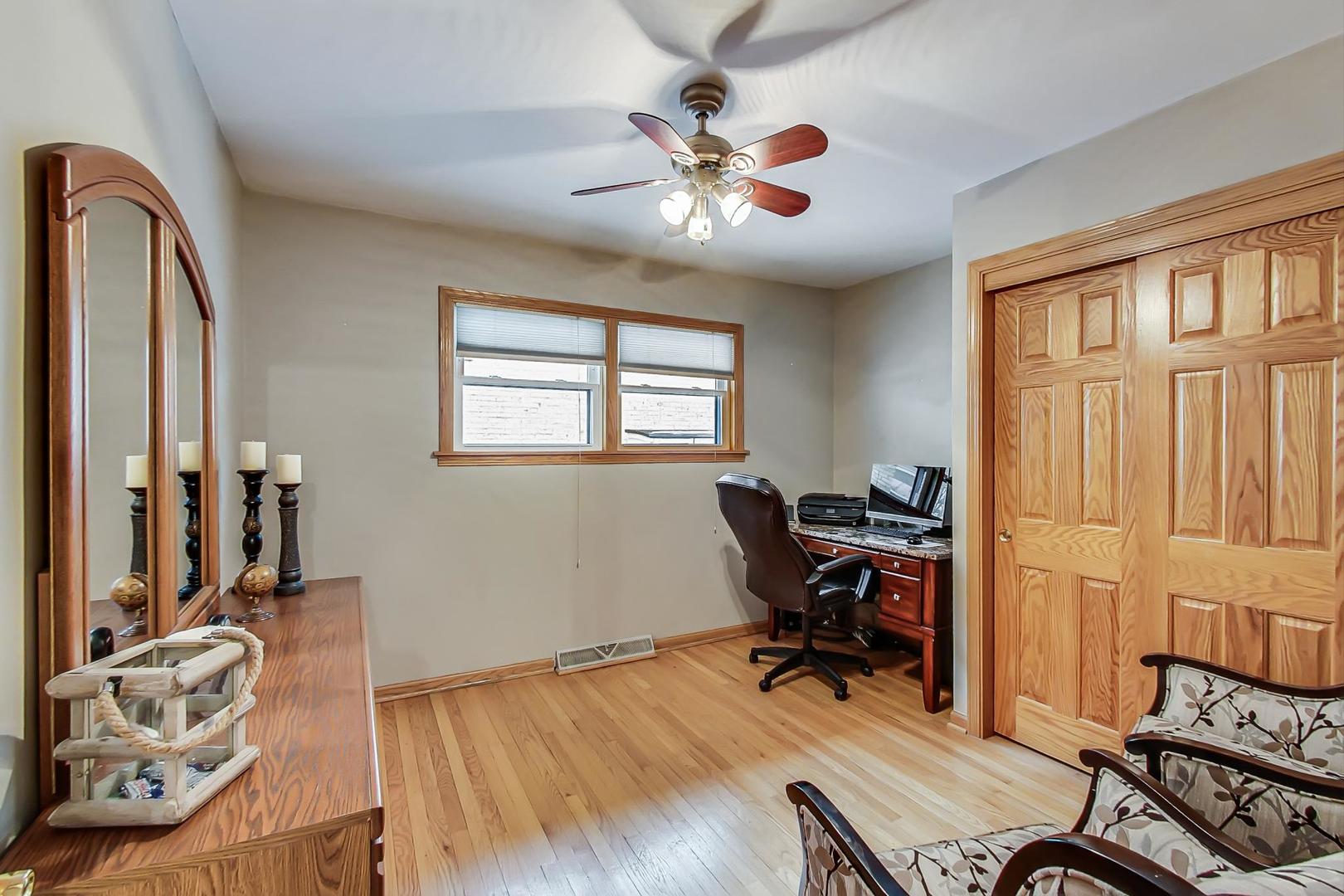 715 Lamon Avenue Wilmette, IL 60091 - Photo 29 of 54 a workspace with wooden floor and a window
