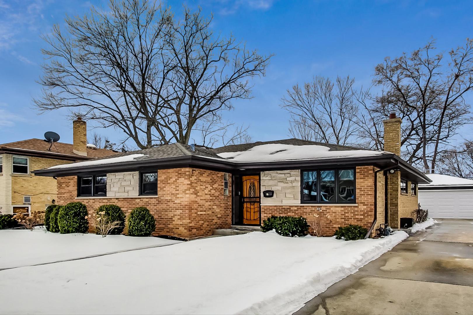 715 Lamon Avenue Wilmette, IL 60091 - Photo 3 of 54 a front view of a house with a yard
