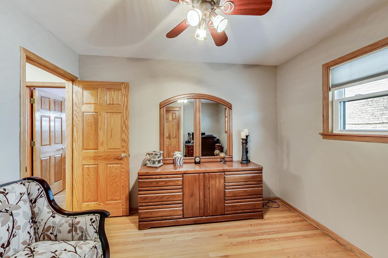 715 Lamon Avenue Wilmette, IL 60091 - Photo 31 of 54 a view of a livingroom with furniture window and wooden floor
