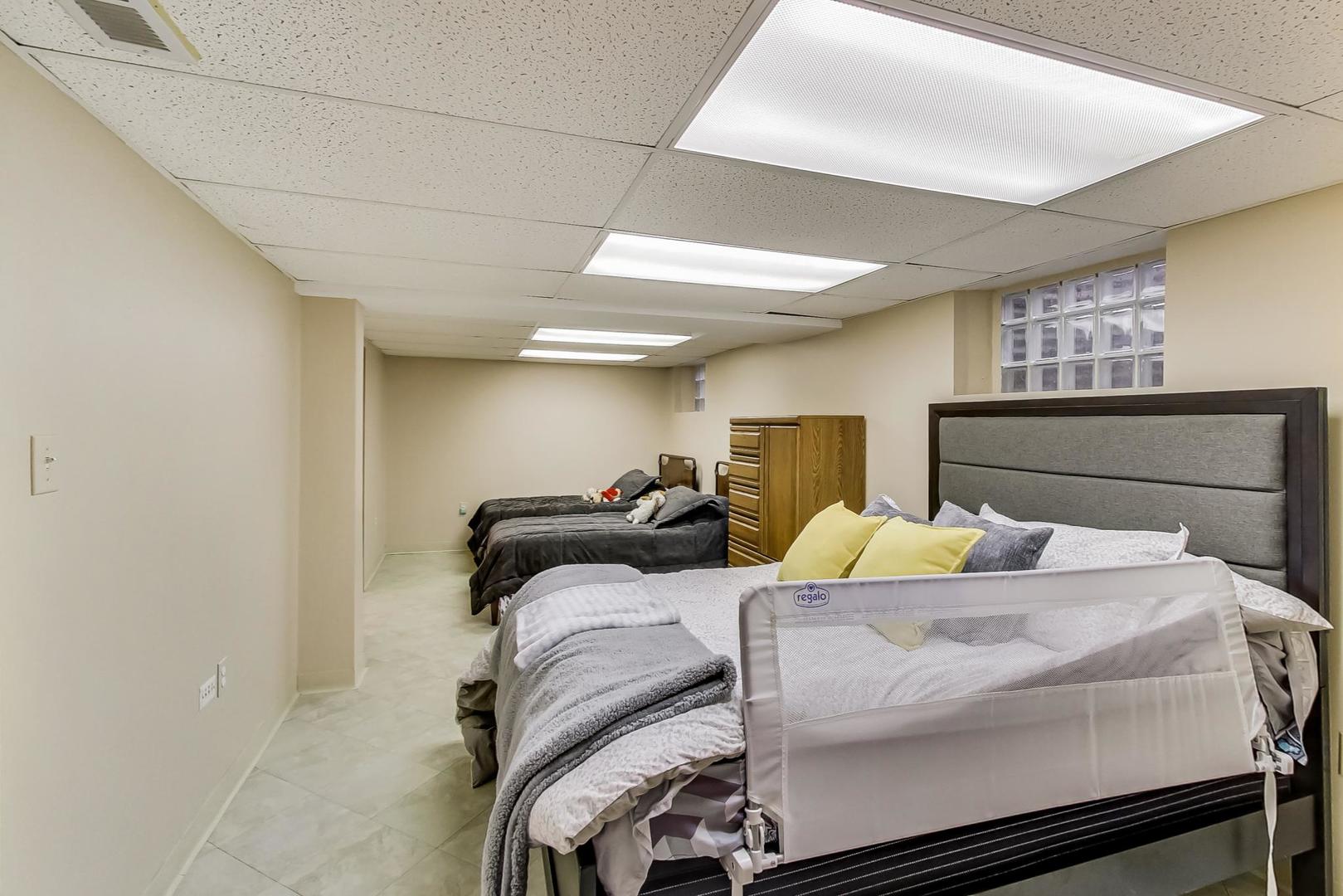 715 Lamon Avenue Wilmette, IL 60091 - Photo 38 of 54 a bedroom with two beds and a table