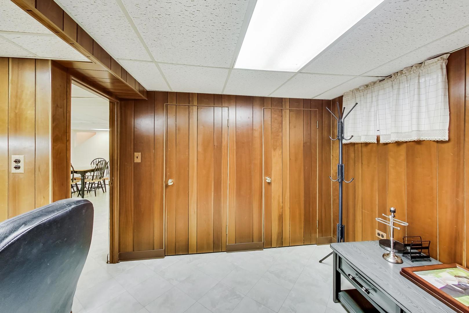 715 Lamon Avenue Wilmette, IL 60091 - Photo 40 of 54 a view of a bathroom with a tub shower and sink