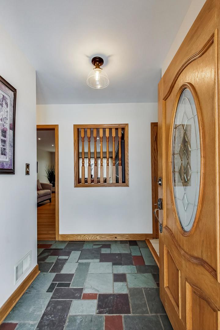 715 Lamon Avenue Wilmette, IL 60091 - Photo 4 of 54 a view of a entryway door with wooden floor