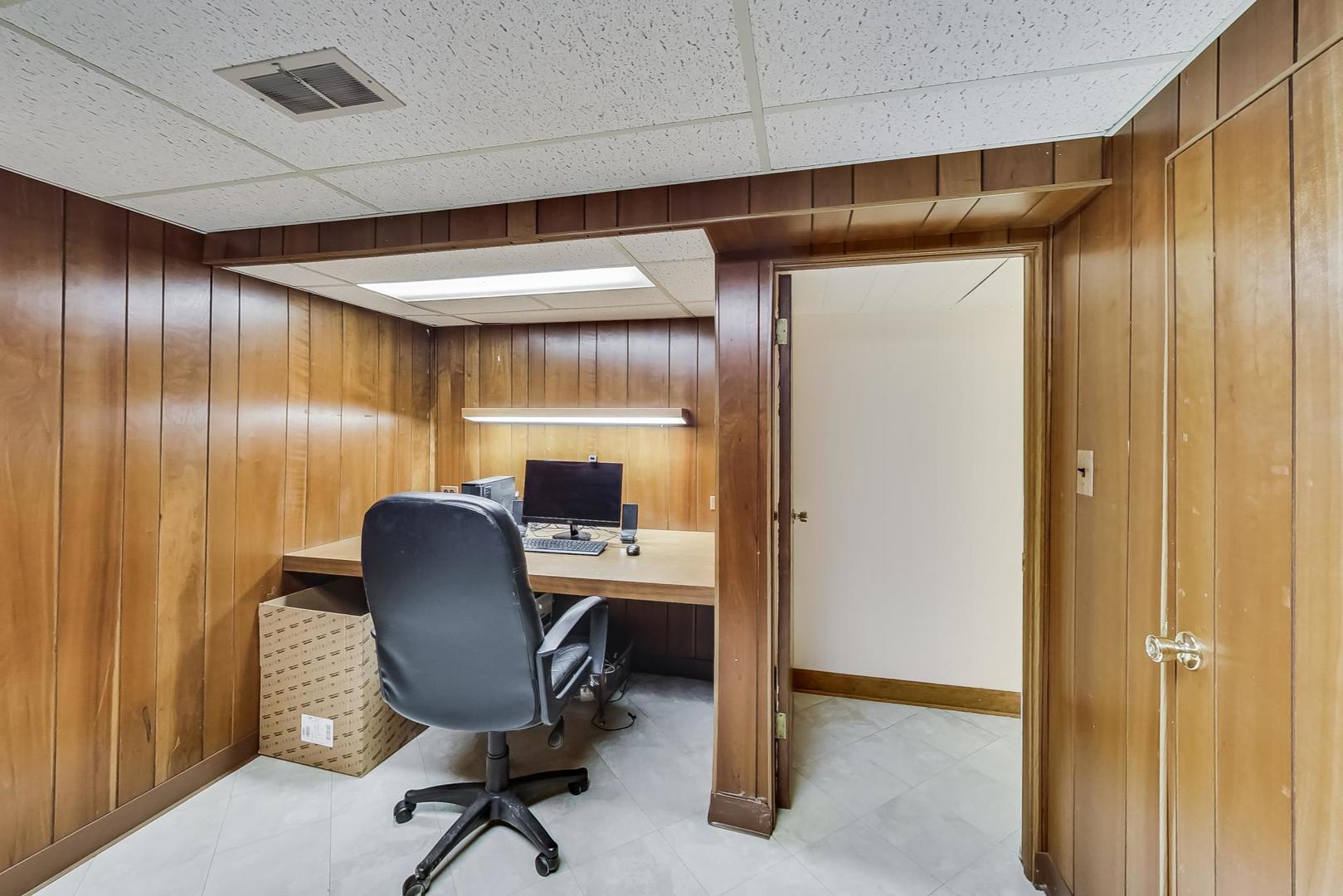 715 Lamon Avenue Wilmette, IL 60091 - Photo 41 of 54 a work room with furniture and a chair