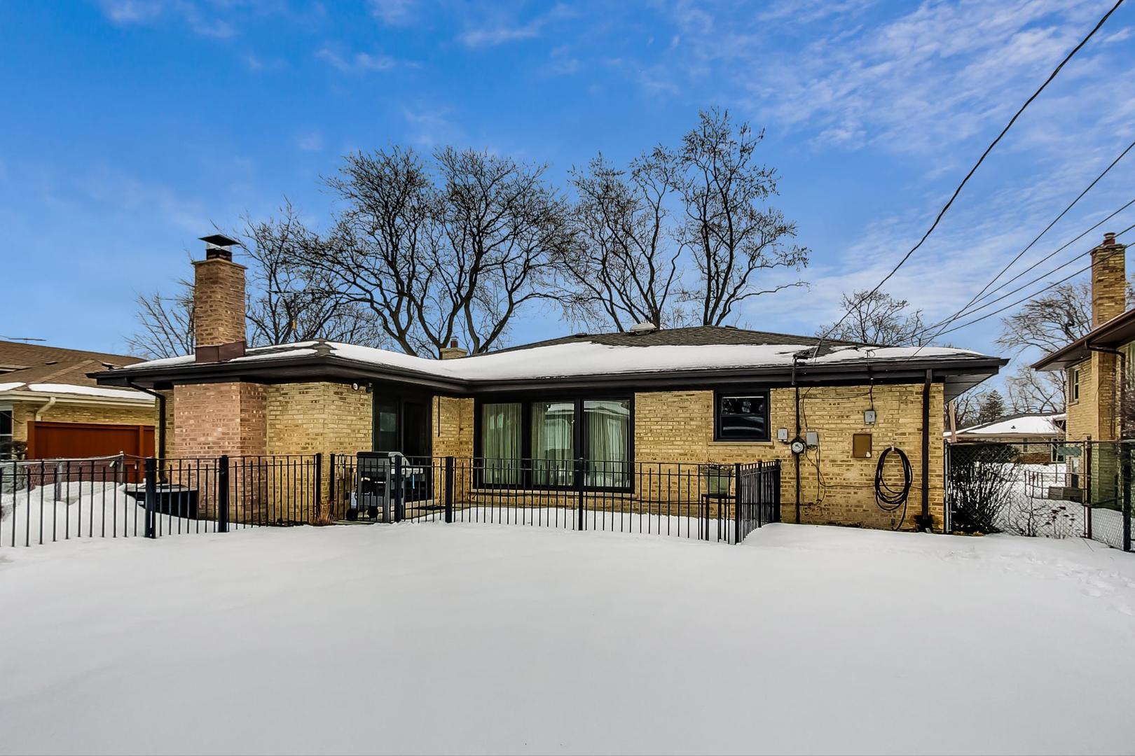 715 Lamon Avenue Wilmette, IL 60091 - Photo 44 of 54 a view of a car park with large trees