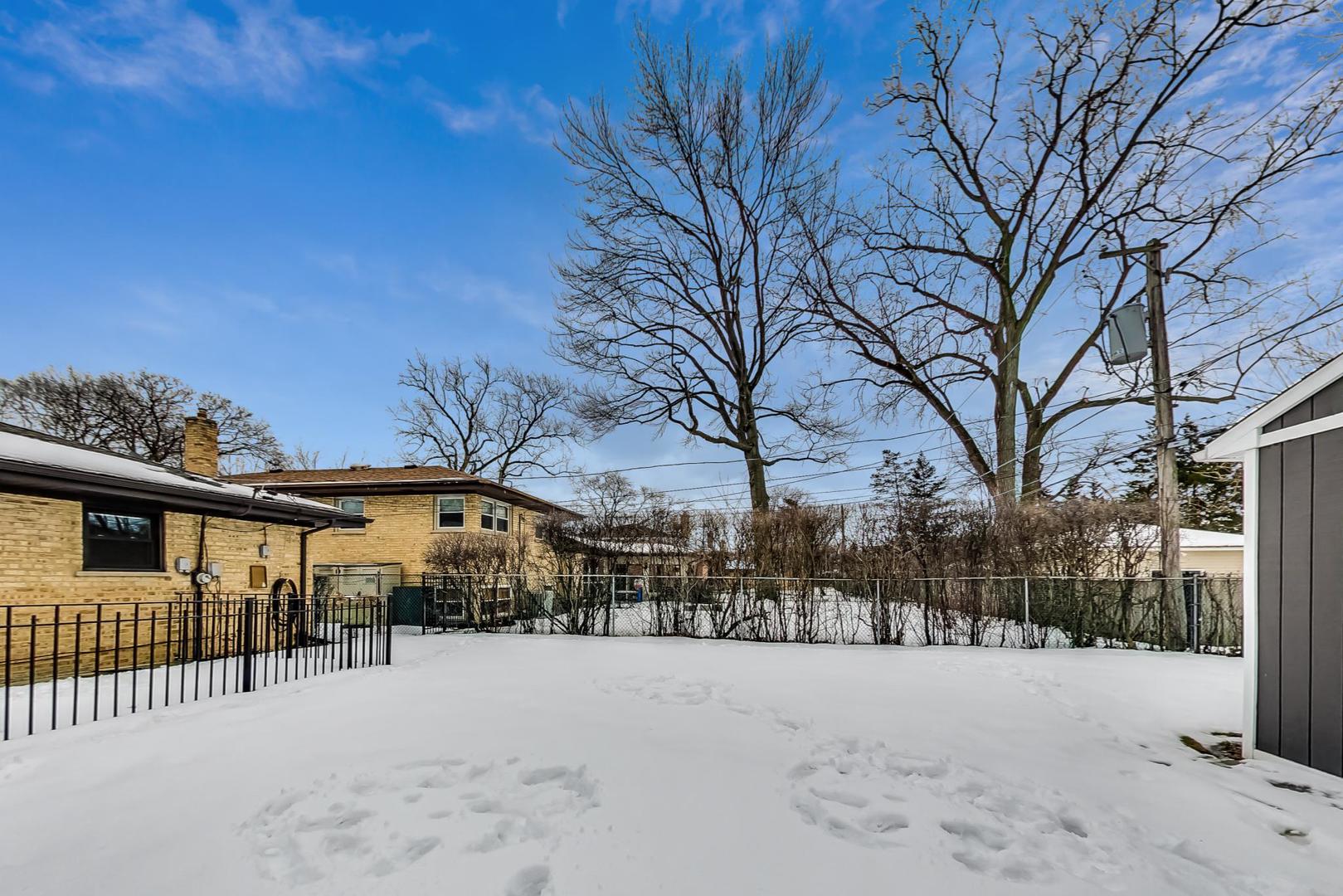 715 Lamon Avenue Wilmette, IL 60091 - Photo 48 of 54 a street view with residential house and tree