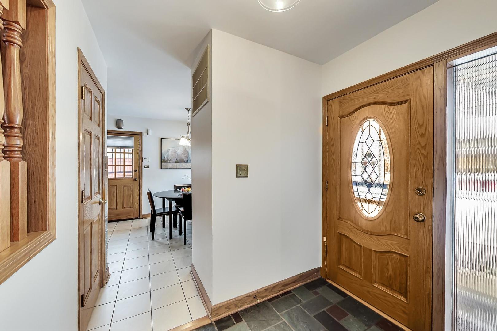 715 Lamon Avenue Wilmette, IL 60091 - Photo 5 of 54 a view of a livingroom with furniture and front door
