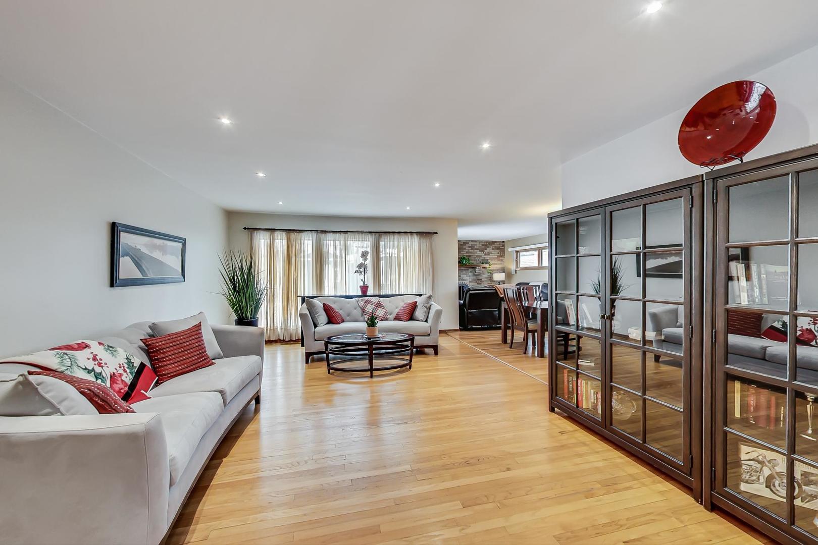 715 Lamon Avenue Wilmette, IL 60091 - Photo 6 of 54 a living room with furniture and a wooden floor