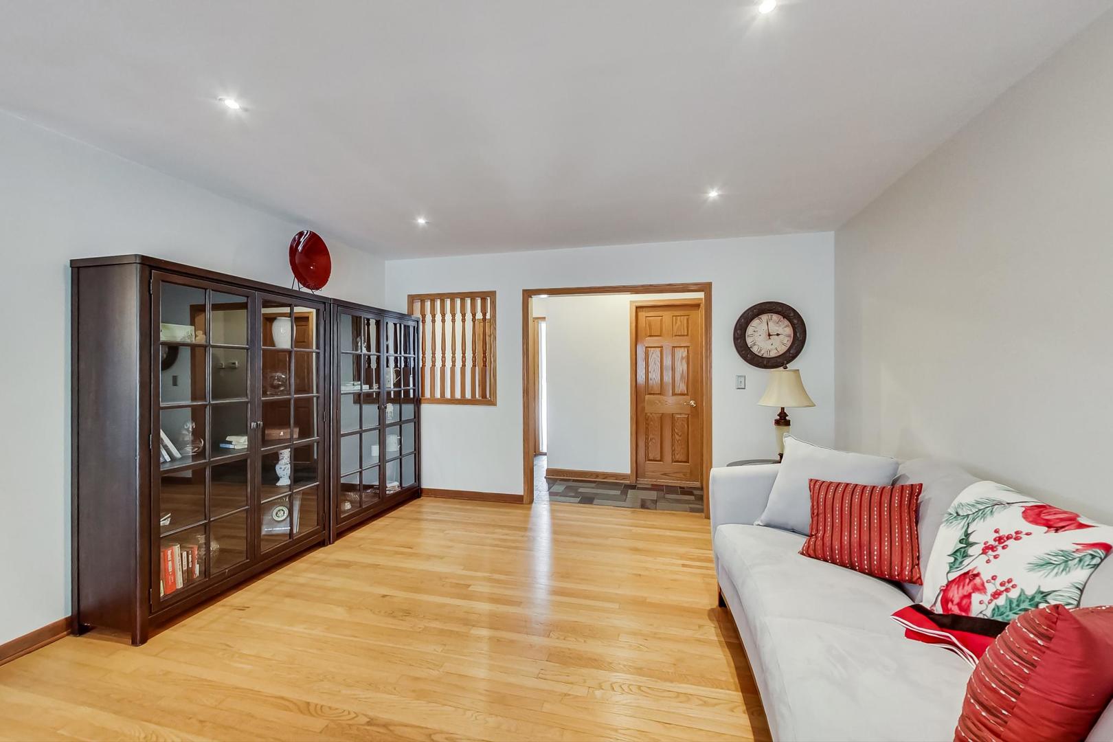 715 Lamon Avenue Wilmette, IL 60091 - Photo 7 of 54 a living room with furniture a window and bookshelf