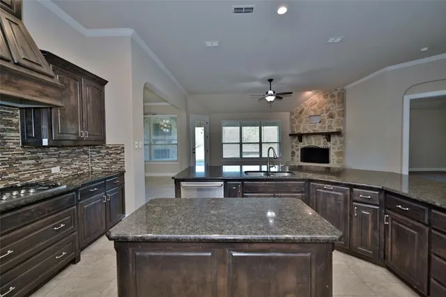 a kitchen with a stove and a sink