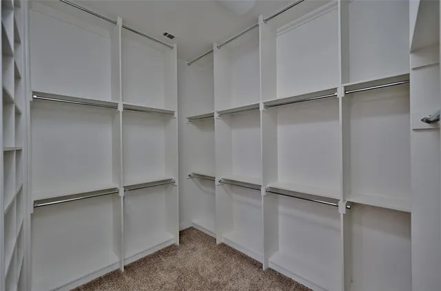 a view of an empty walk in closet
