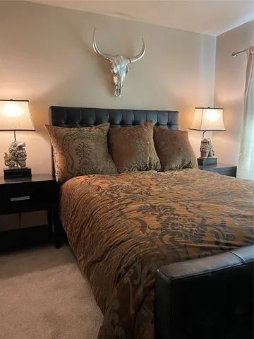 a bedroom with a bed and lamp with night lamp