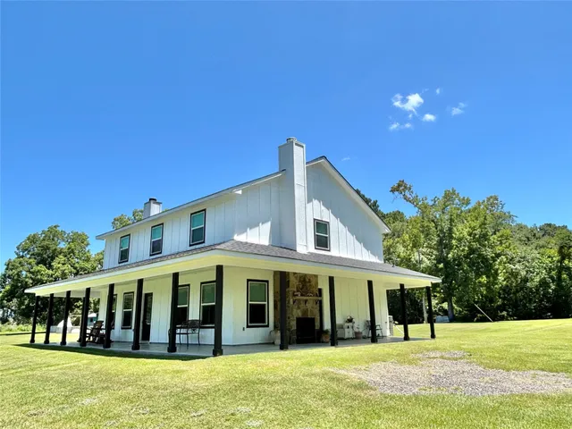 a view of house with a swimming pool