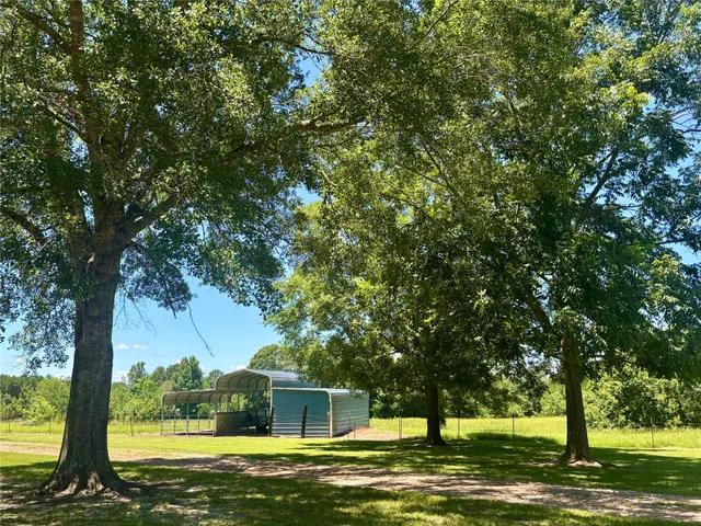 a view of a house with a big yard