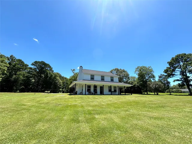 a view of building with huge green field