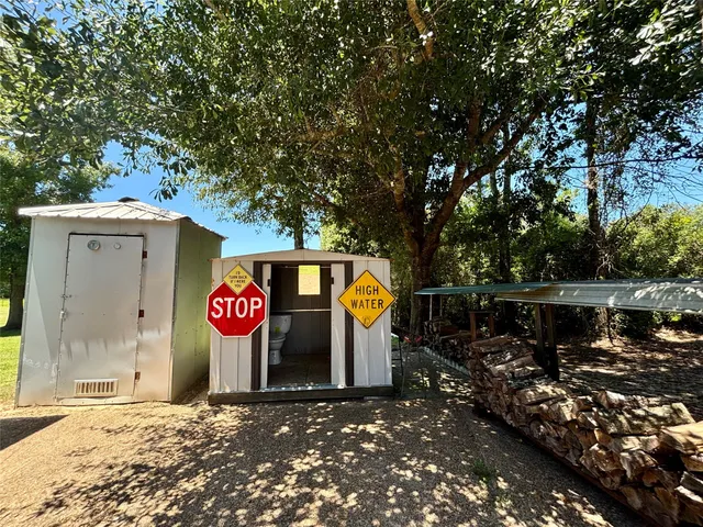 a view of outdoor space sign and tree