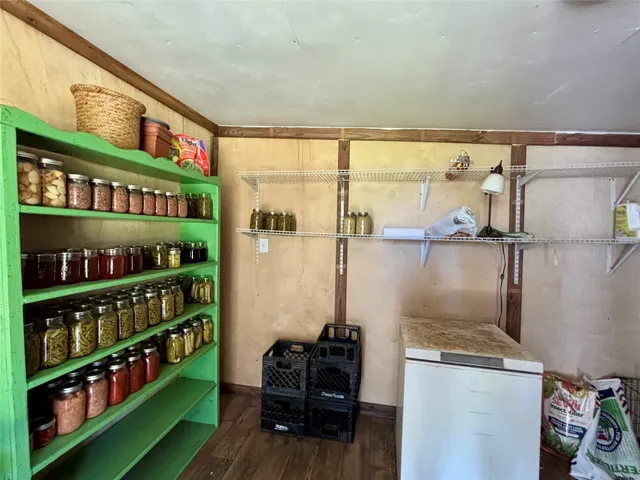 a kitchen with stainless steel appliances a refrigerator and a table