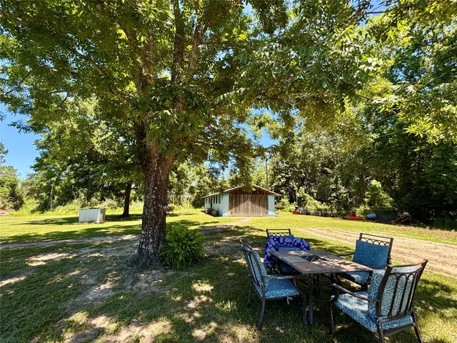 a view of a swimming pool with a table and chairs