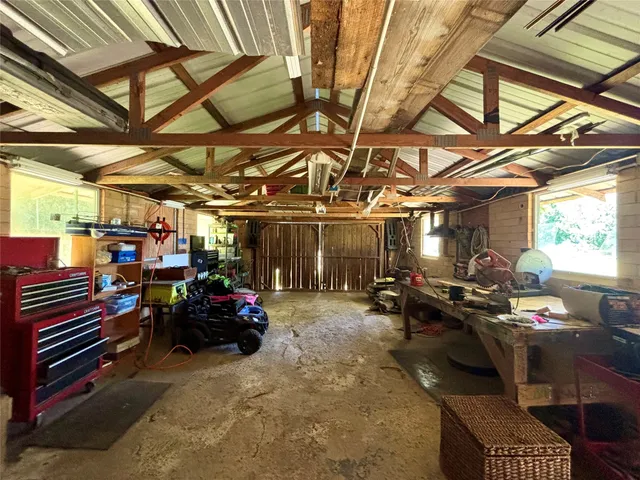 a view of a garage with a table and chairs